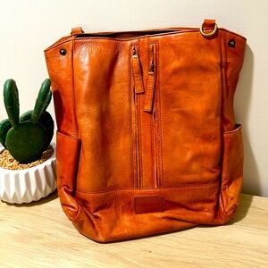 Gently used leather convertible bag, orange/brown leather